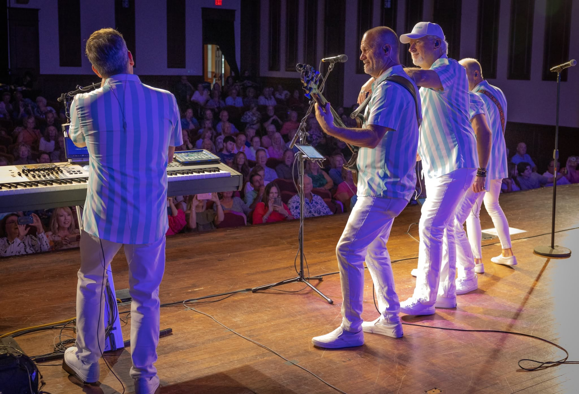 Endless Summer performing on stage with audience